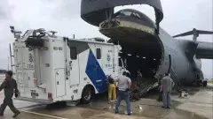 FEMA relief truck getting loaded into an airplane