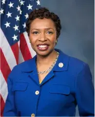 a photo of congresswoman Yvette Clarke with American flag behind her