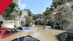 Cars in muddy flood waters