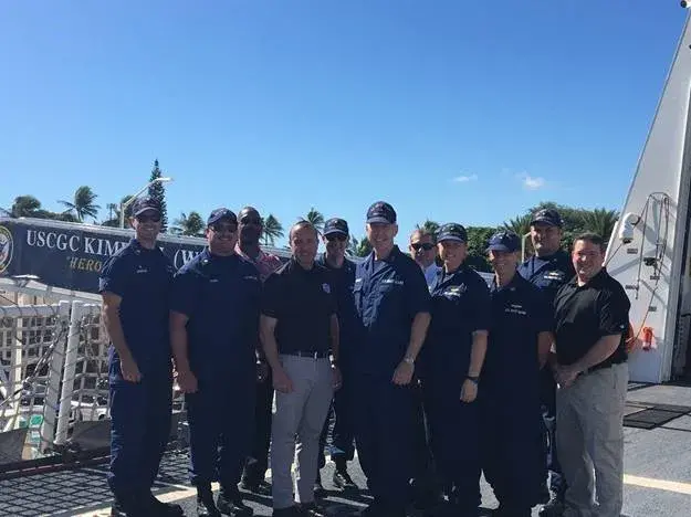 Under Secretary David J. Glawe with the United States Coast Guard and I&A Chief of Staff, Matthew Hanna (far left)