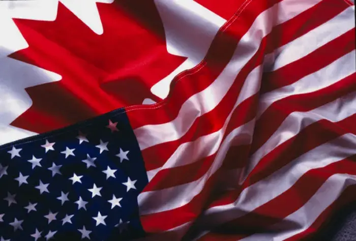 Part of the Canadian flag and the U.S. flag.