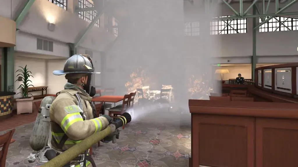 Screenshot from the game of a firefighter putting out flames in a hotel. 